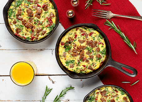 Everything is better in miniature and our Holiday Breakfast Frittatas prove it! These colourful and flavour-filled breakfast dishes can be customized to individual tastes or follow the recipe exactly for guaranteed holiday morning smiles. All the breakfast favourites are accounted for here: eggs, tomatoes, spinach, garlic, and most importantly, Johnsonville Original Recipe Breakfast Sausages.